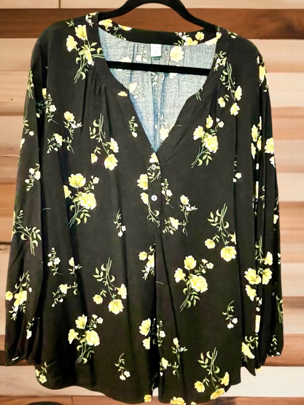 Women’s black blouse with yellow floral design